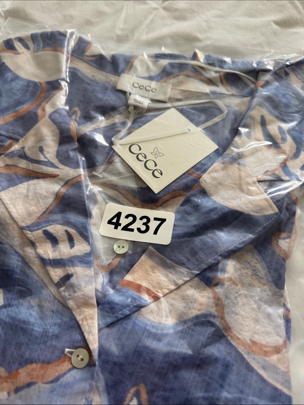 CeCe Blue and Cream Abstract Ruffle Button-Up Top - Picture 9 of 9